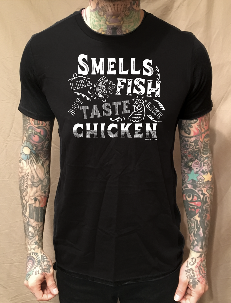 SMELLS LIKE FISH BUT TASTE LIKE CHICKEN BLACK TEE - cristocatofficial